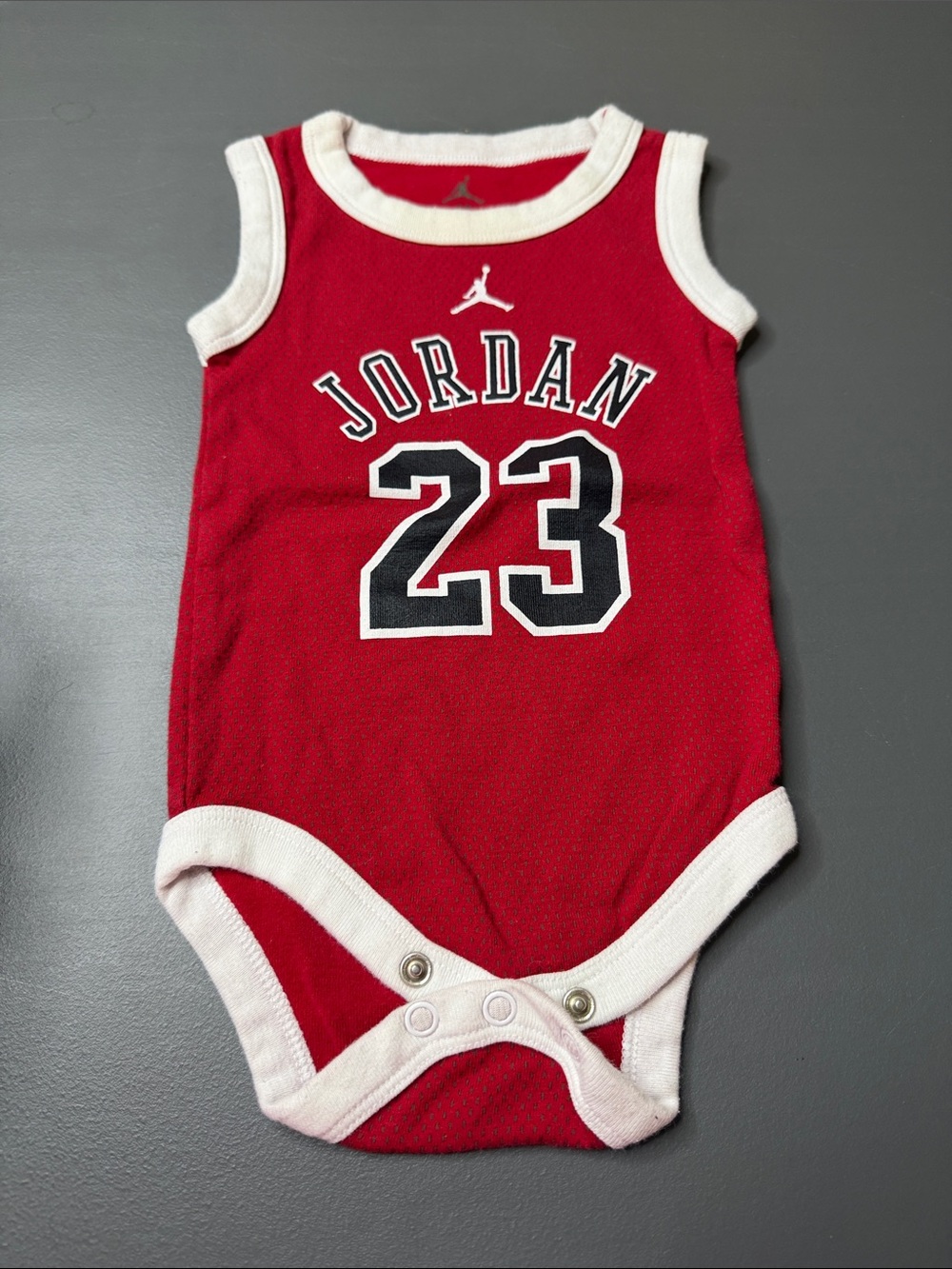 Jordan Red and White Baby Sleeveless Onesie. Size: 0-6M